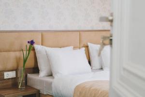 Postel nebo postele na pokoji v ubytování Hotel Alkor