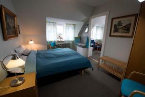 Postel nebo postele na pokoji v ubytování Hotel Lolland