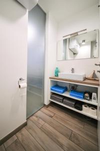 a bathroom with a sink and a mirror at Vacation Station Piran in Piran +37 photos