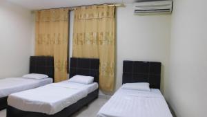 En eller flere senger på et rom på Hotel Ocean