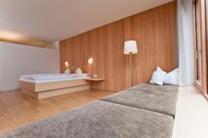Rúm í herbergi á Bio-Hotel Saladina