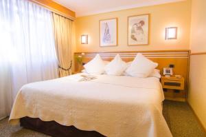 Rúm í herbergi á Hotel Restaurante Ankara