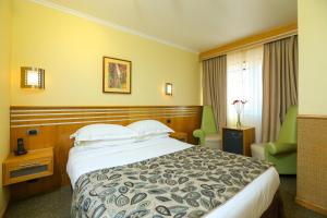 Rúm í herbergi á Hotel Restaurante Ankara
