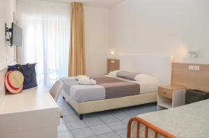 Ένα ή περισσότερα κρεβάτια σε δωμάτιο στο Hotel Torre Sant'Angelo