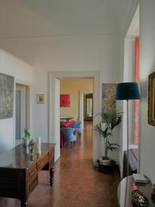 a living room with a table and a couch at Dimora del Conte Sorrento coast seaview in Vico Equense
