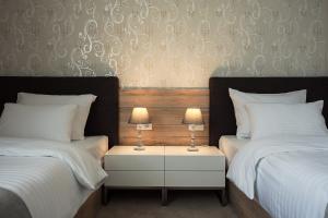 Letto o letti in una camera di IG Hotel