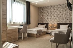 Letto o letti in una camera di IG Hotel