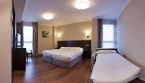 Postel nebo postele na pokoji v ubytování Hotel Río Hortega