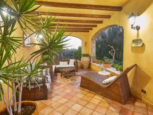 a living room with a patio with plants at Villa Bel Villa by Interhome in Marinella di Selinunte