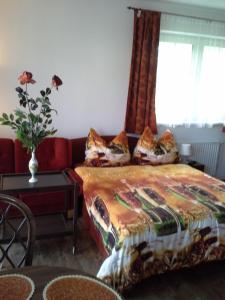 Łóżko lub łóżka w pokoju w obiekcie Vila Patricie