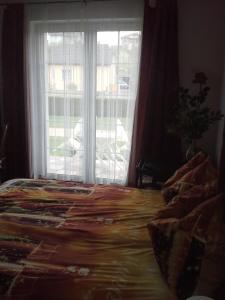 Łóżko lub łóżka w pokoju w obiekcie Vila Patricie