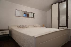 Posteľ alebo postele v izbe v ubytovaní Apartment Kozina
