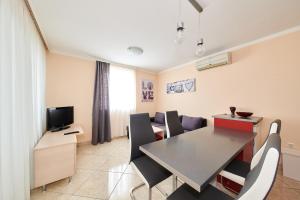 TV a/nebo společenská místnost v ubytování Apartment Vita Moela 23 & 24