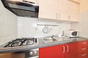 Kuchyň nebo kuchyňský kout v ubytování Apartment Vita Moela 23 & 24
