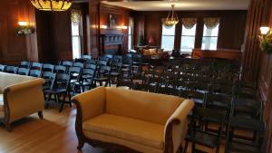 a large room with chairs and a couch at The Inn at Ragged Edge in Chambersburg
