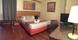 Postel nebo postele na pokoji v ubytování Best Western Hotel Dei Cavalieri