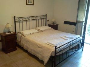 A bed or beds in a room at Agriturismo San Vito