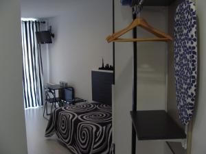 A bed or beds in a room at Hostal JQ Madrid 1
