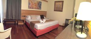 Postel nebo postele na pokoji v ubytování Best Western Hotel Dei Cavalieri
