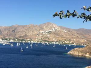 a bunch of boats in a large body of water at Astrio Suites in Livadi