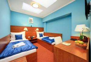 Ein Bett oder Betten in einem Zimmer der Unterkunft Martin Hotel Prague
