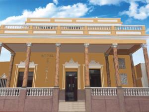 a rendering of a building with columns at Hotel Colonial Inn in Barranquilla