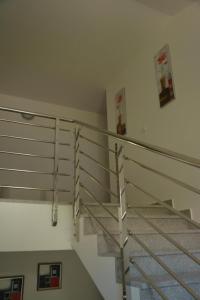 a staircase in a building with metal railing at Apartment Dakic in Herceg-Novi