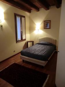 A bed or beds in a room at Valentino b&b