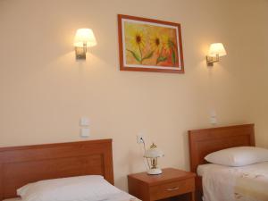 Posteľ alebo postele v izbe v ubytovaní Hotel Kronio