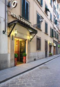 a hotel sign on the side of a building at Hotel S.Giorgio & Olimpic in Florence