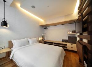 Postel nebo postele na pokoji v ubytování Hotel Clover 769 North Bridge Road