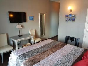 Postel nebo postele na pokoji v ubytování Hotel Restaurant La Caravelle
