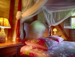 Letto o letti in una camera di Le Parc aux Orchidées