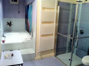 a bathroom with a shower and a toilet and a sink at Oro Rosso Hotel Ristorante in Montefalco +39 photos