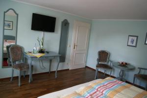 TV a/nebo společenská místnost v ubytování Hotel Stoffels