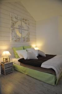 Postel nebo postele na pokoji v ubytování Hotel le P'tit Beaumont
