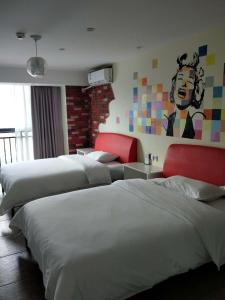 Postelja oz. postelje v sobi nastanitve Zhangjiajie Cat Theme Inn