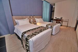 Postel nebo postele na pokoji v ubytování Diamond Inn