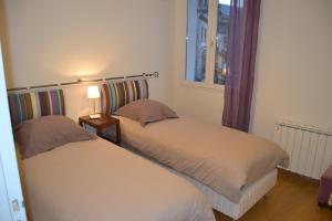 Uma cama ou camas num quarto em Aix Appartements