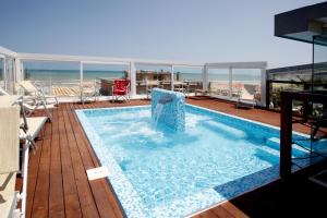 a swimming pool on the deck of a cruise ship at Hotel Panama Majestic in Rimini