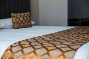 Letto o letti in una camera di Hotel Datini