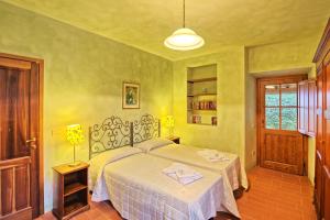 Postel nebo postele na pokoji v ubytování Tenuta by PosarelliVillas