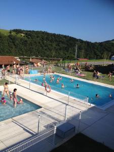 a group of people in a swimming pool at Camping & Bungalows Zumaia in Zumaia