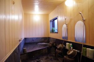 a bathroom with a tub and a sink at Ryoso Chatani in Kyoto +216 photos