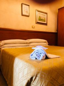 Postel nebo postele na pokoji v ubytování Hotel Casarola - Trigoria