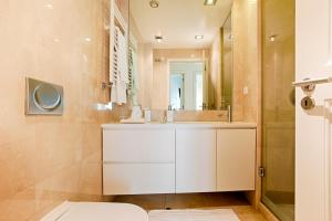 a bathroom with a white sink and a mirror at Libest Chiado 3 - Largo do Picadeiro in Lisbon