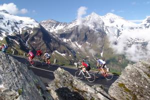 a group of people riding bikes on a mountain road at Apart-Pension Oberreiter in Fusch an der Glocknerstraße