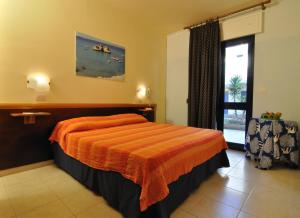Postel nebo postele na pokoji v ubytování Residence Oasi Salento + 37 fotografií