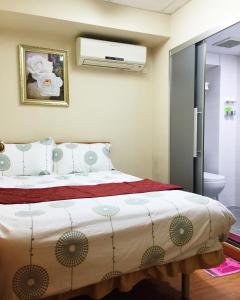 Кровать или кровати в номере Hong Kong Tai San Guest House (Harilela Branch)