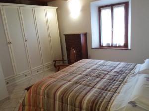 A bed or beds in a room at Appartamento La Volpe